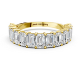 Yellow gold emerald cut diamond half eternity band with shared prong setting_17