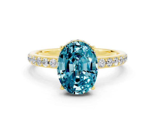 Yellow gold Oval Cut Blue Topaz Solitaire Ring with Pavé Band and Hidden Halo