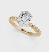 Yellow gold Oval Cut Diamond Solitaire Ring with Beaded Band and Prong Setting