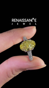Platinum Fancy Yellow Oval  Brilliant Cut Diamond Engagement Ring with Pavé Band and Four-Prong Setting