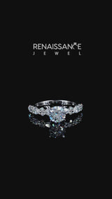 Silver Round Cut Diamond Side Stone Solitaire Ring with Round  and Four-Prong Setting
