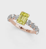 Rose gold Fancy Yellow Emerald Cut Diamond Prong Setting with Side Stones on a Pave Band