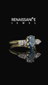 Yellow gold Fancy Blue Oval Cut Diamond Three-Stone Ring with Pear Side Stones and Prong Setting