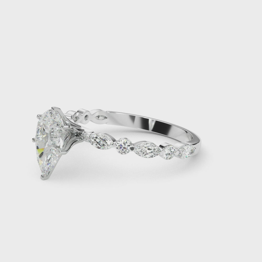 Silver Pear Solitaire with Side Stones on a Pavé Band and Four-Prong Setting 3