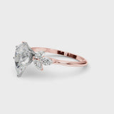Rose gold Pear Diamond Floral Cluster Ring with Marquise Side Stones and Six-Prong Solitaire Setting