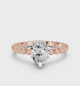 Rose gold Pear Cut Diamond Solitaire Ring with Beaded Band and Prong Setting