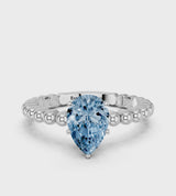 Platinum Fancy Blue Pear Cut Diamond Solitaire Ring with Beaded Band and Prong Setting