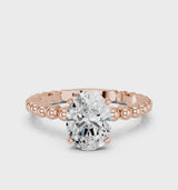 Rose gold Oval Cut Diamond Solitaire Ring with Beaded Band and Prong Setting