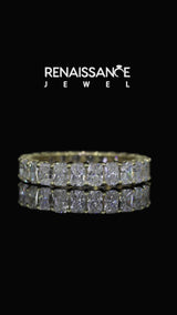 Yellow gold radiant cut diamond eternity band with shared prong setting