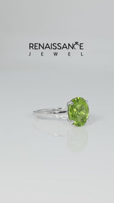 Silver Oval Cut Peridot Solitaire Engagement Ring with Classic Band and Four-Prong Setting