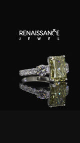 White gold Fancy Yellow Radiant  Cut Diamond Three-Stone Ring with Round Side Stones and Pavé Band