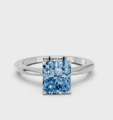 Platinum Fancy Blue Radiant Cut Diamond Solitaire Ring with Six-Prong Setting and Classic Band