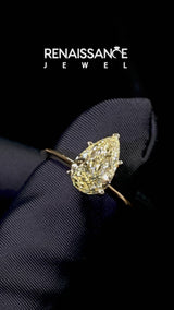 Yellow gold Fancy Yellow Pear Cut Diamond Solitaire Engagement Ring with Classic Band and Four-Prong Setting