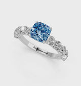 Silver Fancy Blue Cushion Cut Diamond Prong Setting with Side Stones on a Pave Band