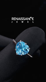 Silver Heart Cut Blue Topaz Solitaire Ring with Flower Prong Setting and Classic Band