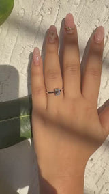 Silver Emerald Solitaire Engagement Ring with Cathedral Band and Four-Prong Setting
