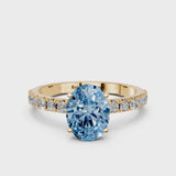 Yellow gold Fancy Blue Oval Cut Diamond Solitaire Pavé Band with Four-Prong Setting