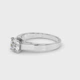 Platinum Heart Solitaire Engagement Ring with Four-Prong Setting and Tapered Band