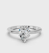 White gold Pear Cut Diamond Solitaire Ring with Six-Prong Setting and Classic Band