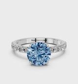 White gold Fancy Blue Round Cut Diamond Solitaire Pavé Band with Four-Prong Setting