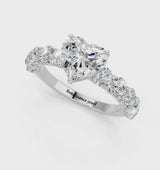 White gold Heart Cut Diamond Prong Setting with Side Stones on a Pave Band