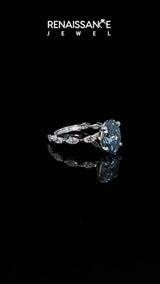 White gold Fancy Blue Oval Cut Diamond Ring with Marquise Side Stones and Prong Setting