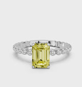 Platinum Fancy Yellow Emerald Cut Diamond Solitaire Ring with Beaded Band and Prong Setting
