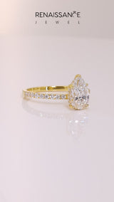 Yellow gold Pear Cut Diamond Solitaire Ring with Round  Pavé Band and Four-Prong Setting
