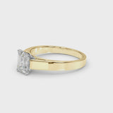 Yellow gold Emerald Solitaire Engagement Ring with Four-Prong Setting and Tapered Band