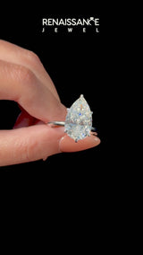 Platinum Pear Cut Diamond Solitaire Engagement Ring with Classic Band and Four-Prong Setting