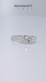 Platinum Three-Stone Emerald Cut Diamond Ring with Round  Pavé Band and Prong Setting