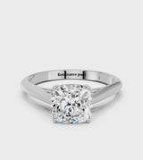 Platinum Cushion Cut Diamond Solitaire Engagement Ring with Cathedral Setting and Four-Prong Mount
