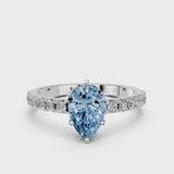 White gold Fancy Blue Pear Cut Diamond Solitaire Pavé Band with Four-Prong Setting