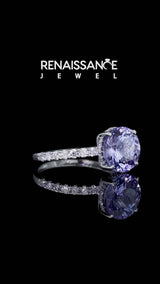 Silver Round Cut Tanzanite Solitaire Ring with Round  Pavé Band and Four-Prong Setting