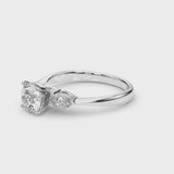 White gold Three-Stone Heart Cut Diamond Ring with Pear Side Stones and Four-Prong Setting