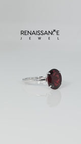 Silver Oval Cut Garnet Solitaire Engagement Ring with Classic Band and Four-Prong Setting