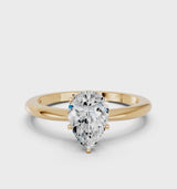 Yellow gold Pear Cut Diamond Solitaire Ring with Six-Prong Setting and Classic Band