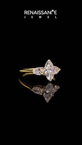 Yellow gold Three-Stone Marquise Cut Diamond Ring with Pear Side Stones and Four-Prong Setting