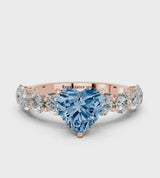 Rose gold Fancy Blue Heart Cut Diamond Prong Setting with Side Stones on a Pave Band