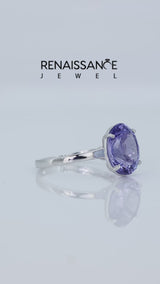 Silver Oval Cut Tanzanite Solitaire Engagement Ring with Classic Band and Four-Prong Setting