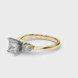 Yellow gold Three-Stone Princess Cut Diamond Ring with Pear Side Stones and Four-Prong Setting