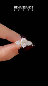 Yellow gold Marquise Cut Diamond Three-Stone Ring with Pear  Side Stones and Prong Setting