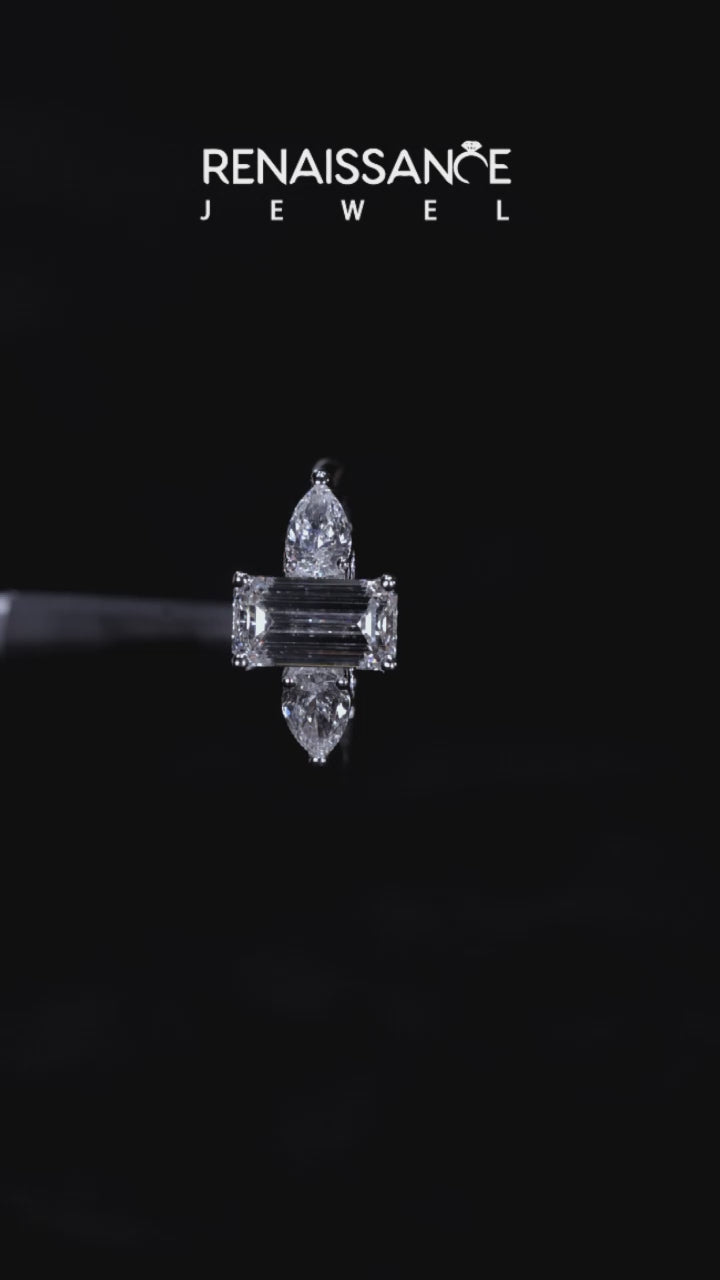 Silver Three-Stone Emerald Cut Diamond Ring with Pear Side Stones on a Platinum Band and Four-Prong Setting 4