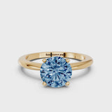 Yellow gold Fancy Blue Round Cut Diamond Solitaire Ring with Six-Prong Setting and Classic Band