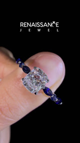 Platinum Cushion Cut Diamond Ring with Marquise and Round with Blue Sapphire side stone Side Stones and Four-Prong Setting