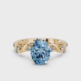 Yellow gold Fancy Blue Oval  Solitaire Twisted Band with Prong Setting