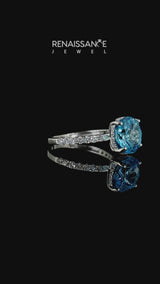 Silver Round Cut Blue Topaz Solitaire Ring with Round  Pavé Band and Four-Prong Setting