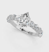 Platinum Pear Cut Diamond Prong Setting with Side Stones on a Pave Band