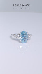 Platinum Fancy Blue Oval Cut Diamond Three-Stone Ring with Pear  Side Stones and Prong Setting