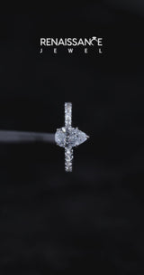 White gold Pear Cut Diamond Solitaire Ring with Pavé Accents and Four-Prong Setting